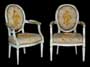 Paar Louis XVI-Armlehnstühle.